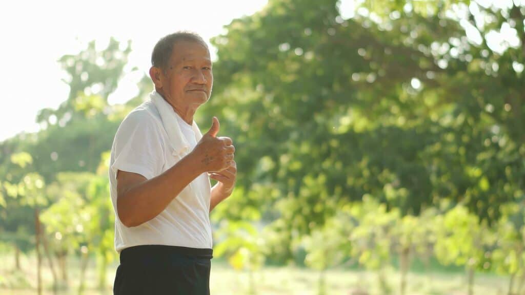 Asian elderly man exercising outdoors
