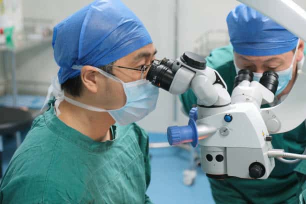 doctors and nurse performing cataract surgery
