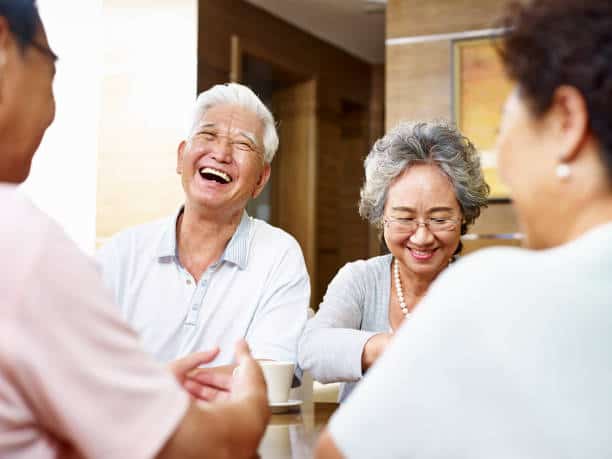 senior asian people getting together and having a good time