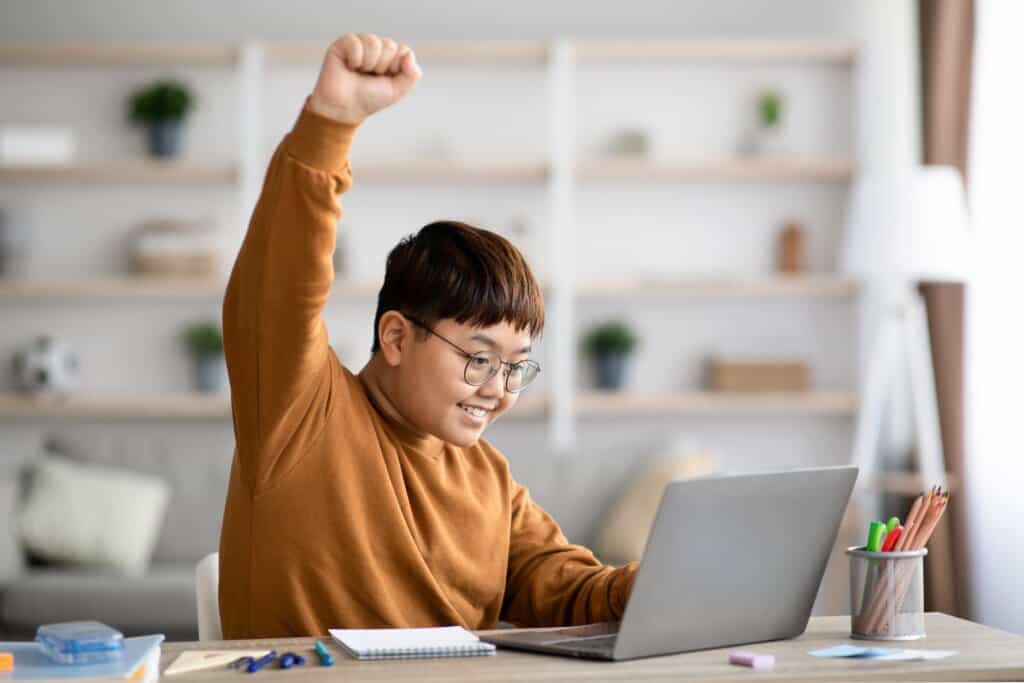 a kid with glasses smiling