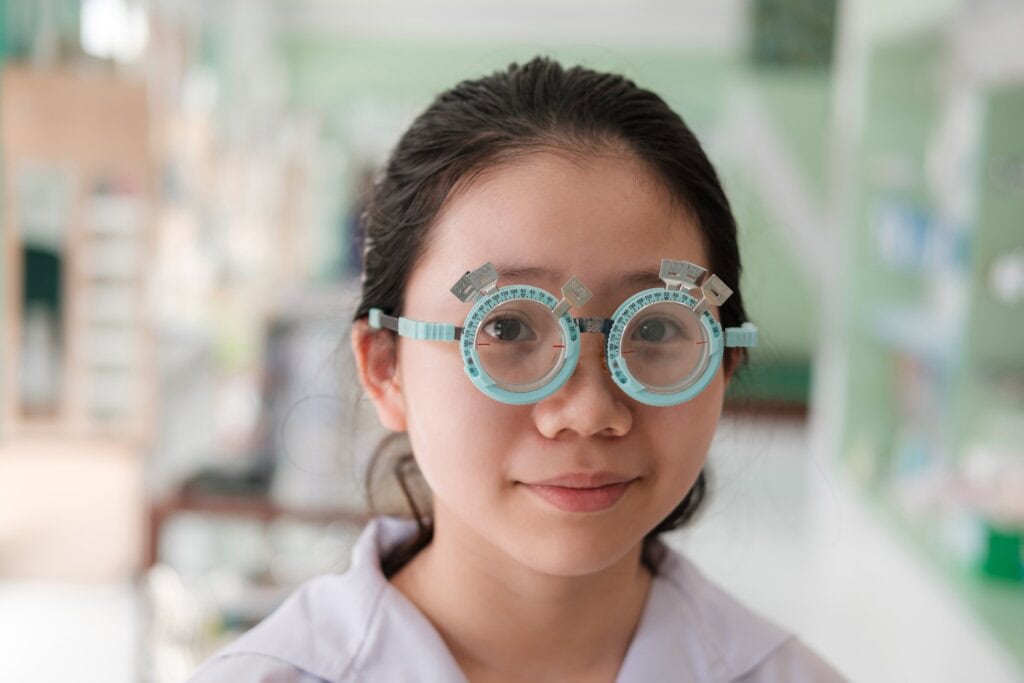 a young girl wearing a refractor