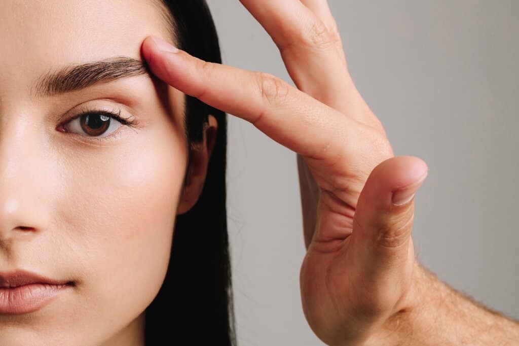 a woman with lifted eyelids