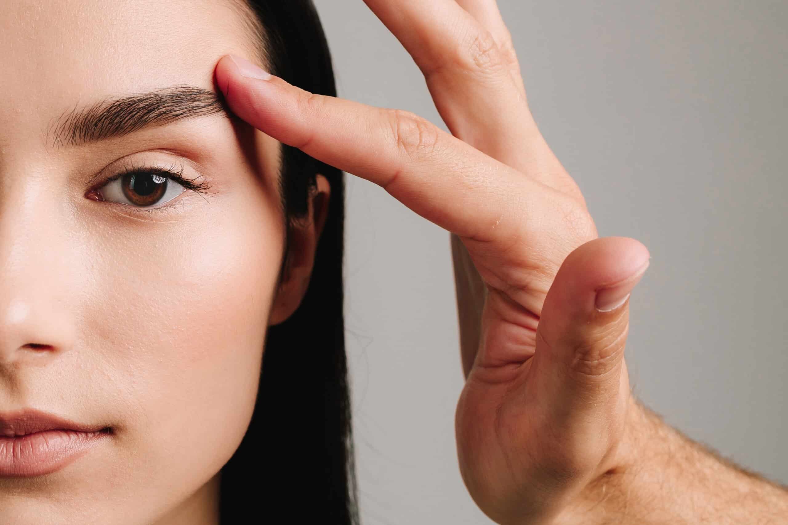 a woman with lifted eyelids