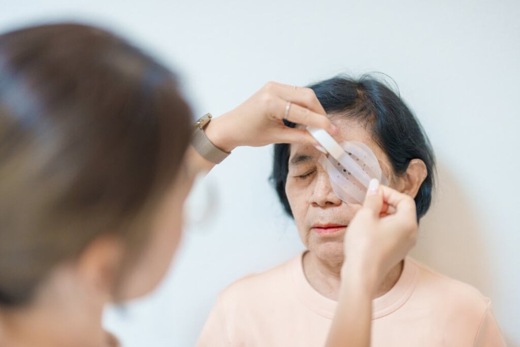 a mature woman with eye protection after surgery