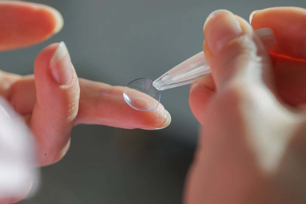 a person about to wear a contact lens