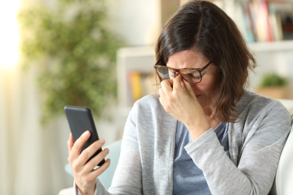 a woman suffering from eyestrain 