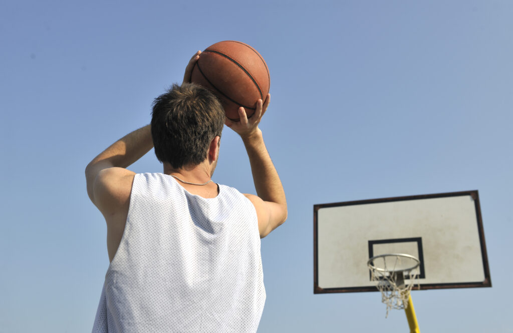 a man doing basketball shoot